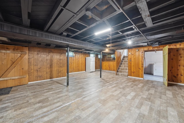 18140 Westover Ave, Southfield, MI 48075 - basement with washer / clothes dryer, stairway, wood finished floors, freestanding refrigerator, and wooden walls