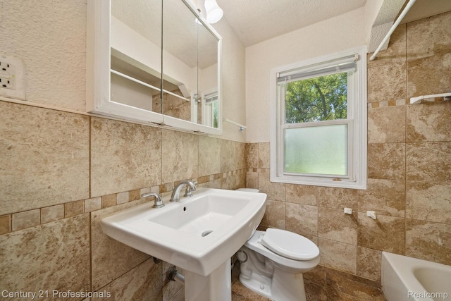 18140 Westover Ave, Southfield, MI 48075 - bathroom with a tub to relax in, tile walls, a shower, and a wainscoted wall