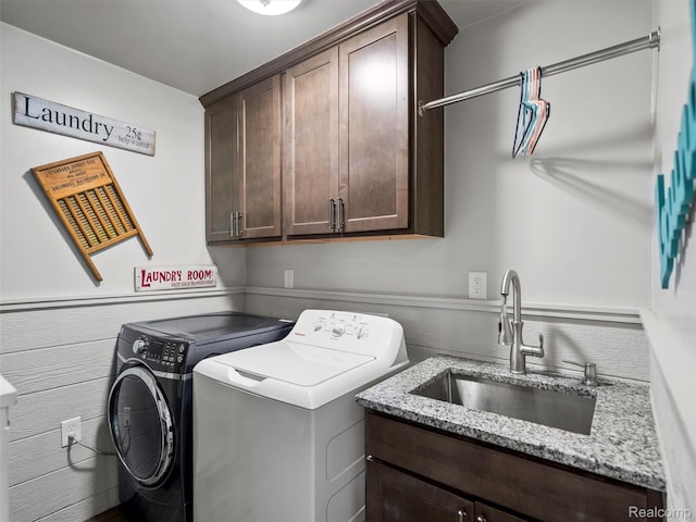 3365 Howland Rd, Almont, MI 48003 - laundry room featuring washer and clothes dryer and cabinet space