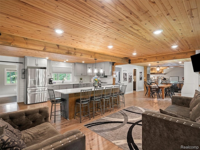3365 Howland Rd, Almont, MI 48003 - living area featuring wood finished floors, wooden ceiling, and recessed lighting