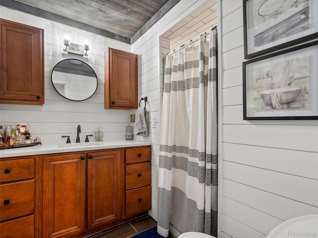 3365 Howland Rd, Almont, MI 48003 - full bath featuring vanity, a shower with curtain, tile patterned floors, and wood walls