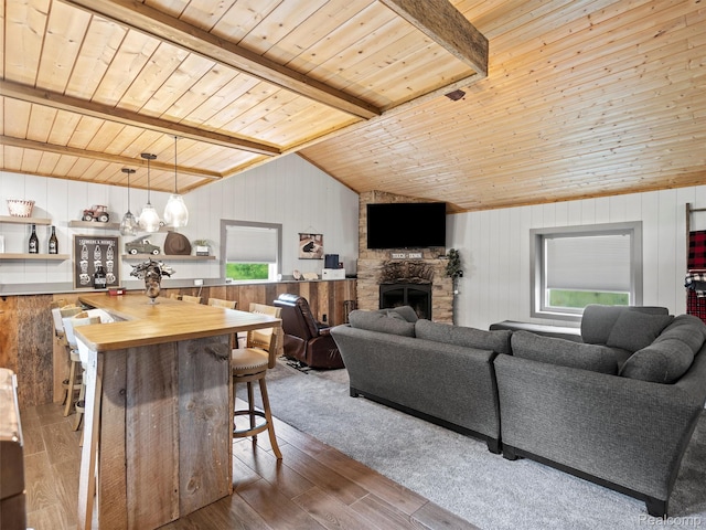 3365 Howland Rd, Almont, MI 48003 - living area with wooden walls, wooden ceiling, wood finished floors, and a fireplace