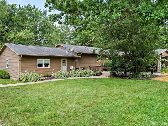 3365 Howland Rd, Almont, MI 48003 - tri-level home featuring a front lawn and a shingled roof
