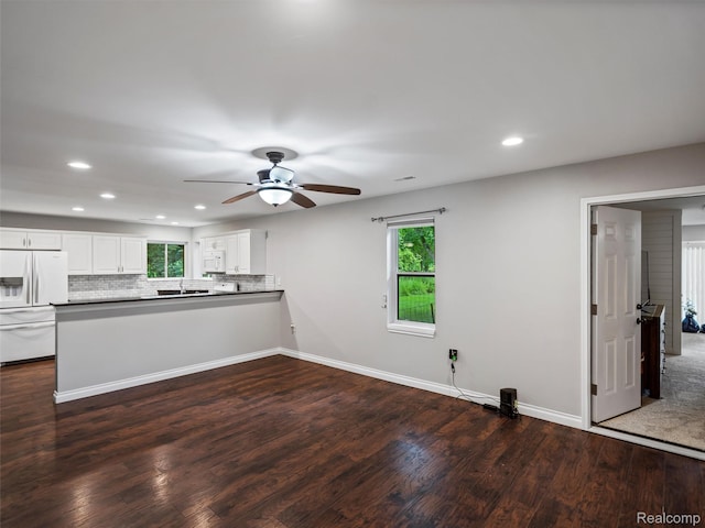 3365 Howland Rd, Almont, MI 48003 - kitchen featuring white appliances, recessed lighting, dark wood finished floors, ceiling fan, and a peninsula
