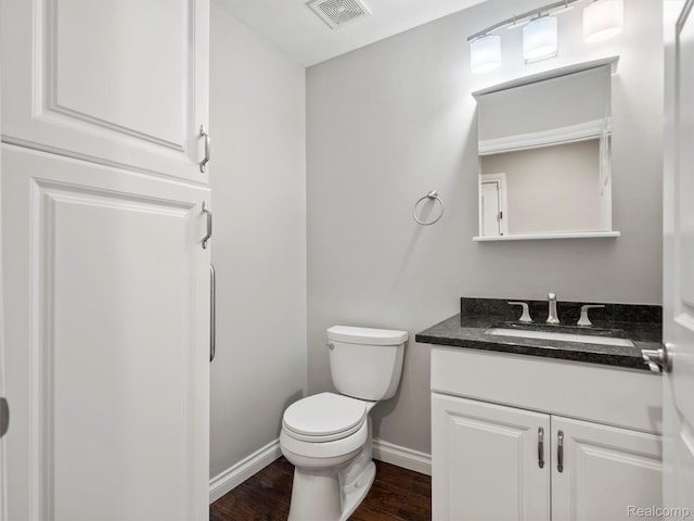 3365 Howland Rd, Almont, MI 48003 - half bath featuring vanity and wood finished floors