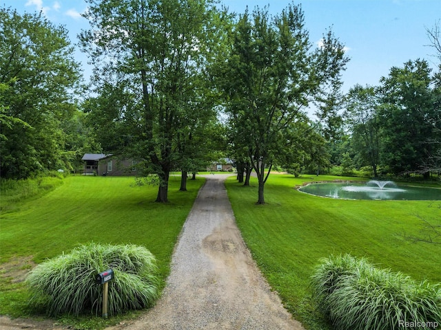 3365 Howland Rd, Almont, MI 48003 - view of property's community with a water view, a lawn, and driveway