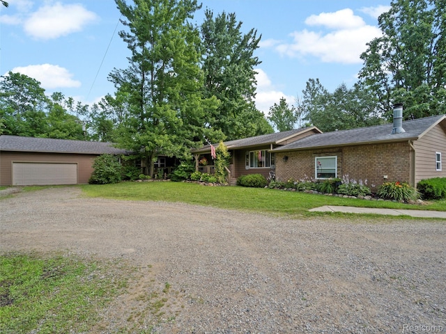 3365 Howland Rd, Almont, MI 48003 - ranch-style house featuring dirt driveway, a front lawn, brick siding, and roof with shingles