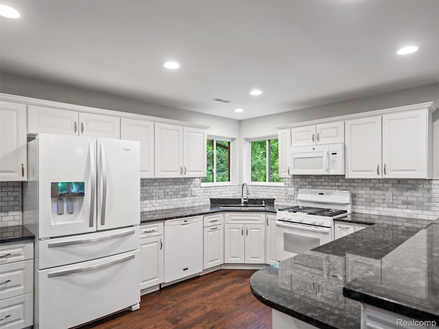 3365 Howland Rd, Almont, MI 48003 - kitchen with white appliances, white cabinetry, backsplash, dark wood-style flooring, and recessed lighting