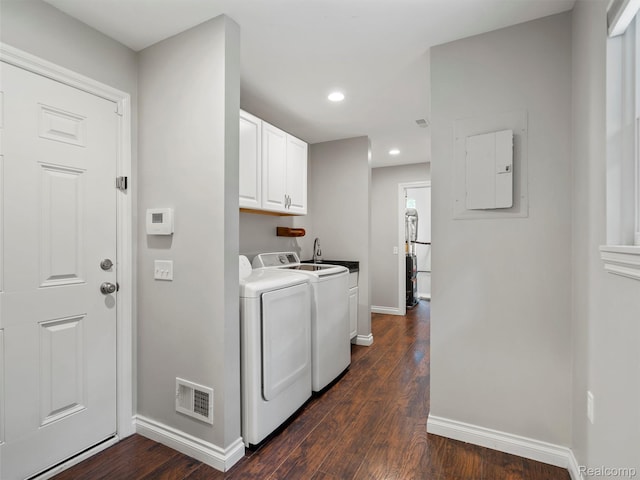 3365 Howland Rd, Almont, MI 48003 - laundry area featuring cabinet space, dark wood-type flooring, washer and dryer, recessed lighting, and electric panel