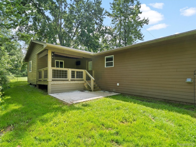 3365 Howland Rd, Almont, MI 48003 - rear view of house with a patio and a yard