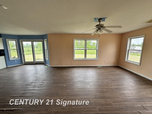 7265 Deweigan Ln, Mount Pleasant, MI 48858 - unfurnished room featuring dark wood finished floors and plenty of natural light