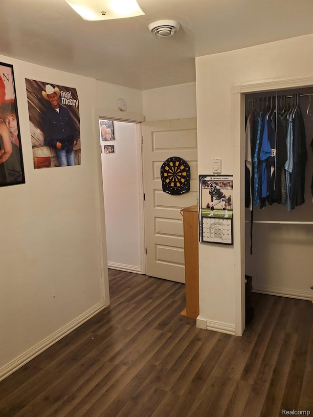 244 S Sherman St, Vassar, MI 48768 - hallway with dark wood finished floors and baseboards