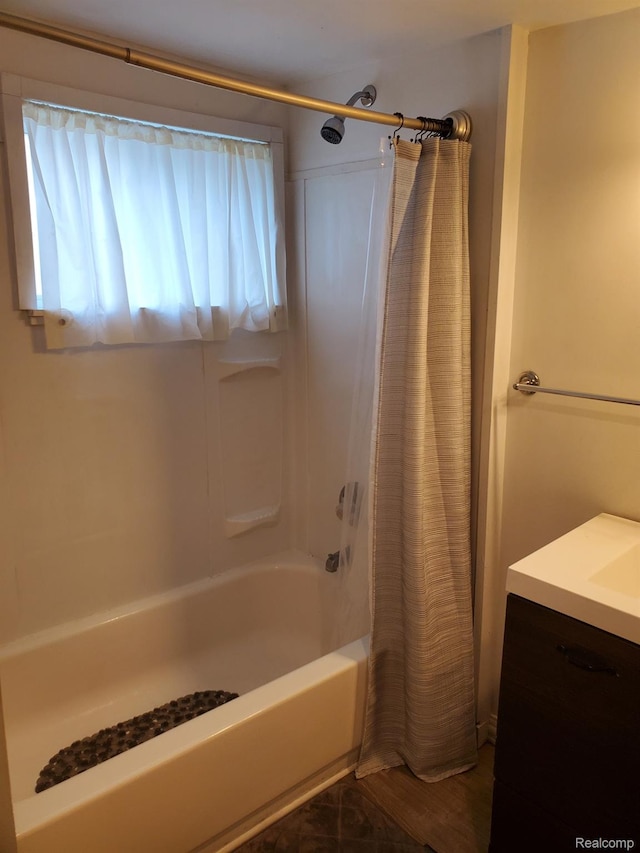 244 S Sherman St, Vassar, MI 48768 - bathroom featuring shower / tub combo and vanity