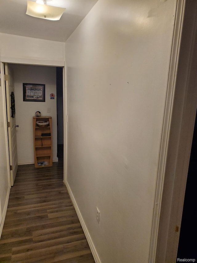 244 S Sherman St, Vassar, MI 48768 - corridor with baseboards and dark wood finished floors
