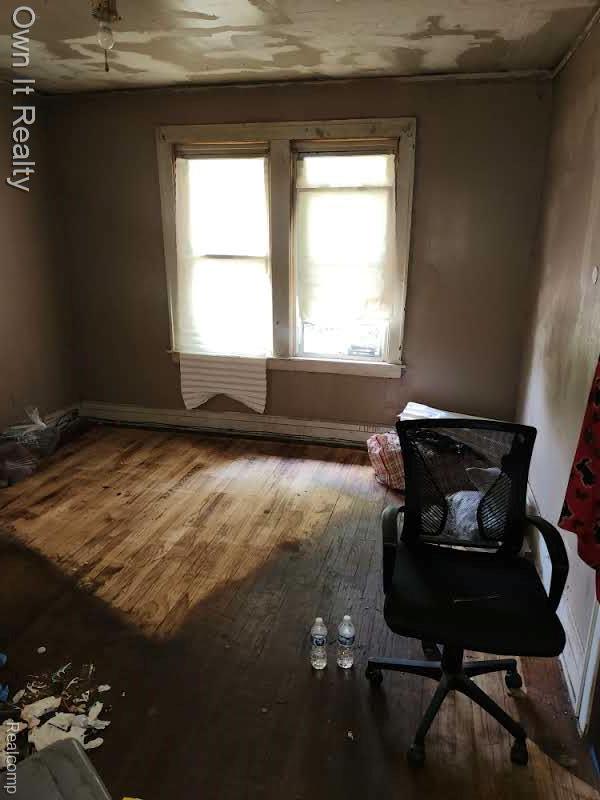 1950 Lawrence St, Detroit, MI 48206 - spare room featuring plenty of natural light and wood-type flooring