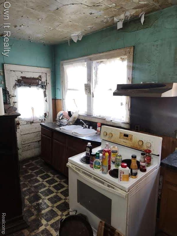 1950 Lawrence St, Detroit, MI 48206 - kitchen featuring white electric range and under cabinet range hood