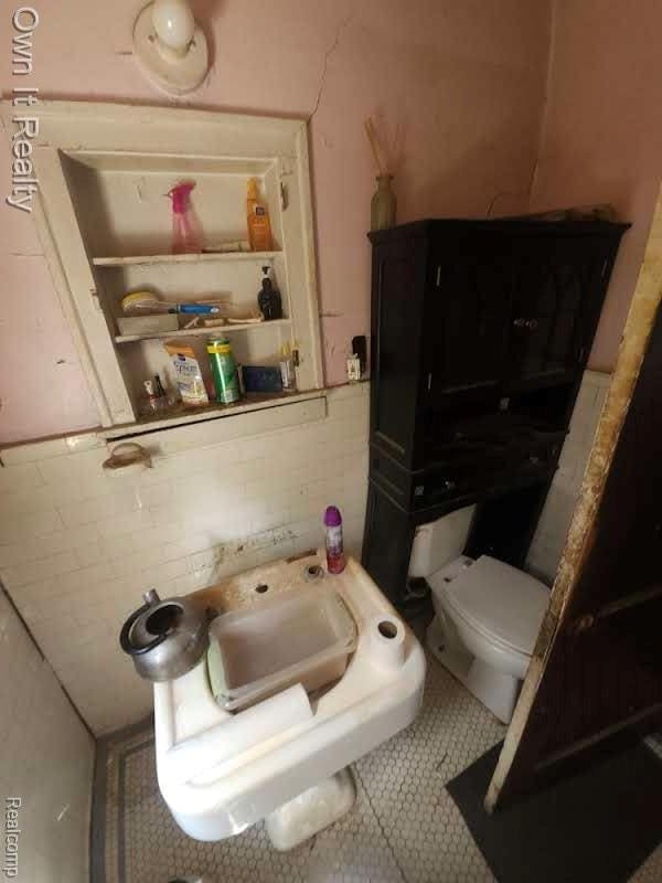1950 Lawrence St, Detroit, MI 48206 - bathroom with toilet and tile patterned floors