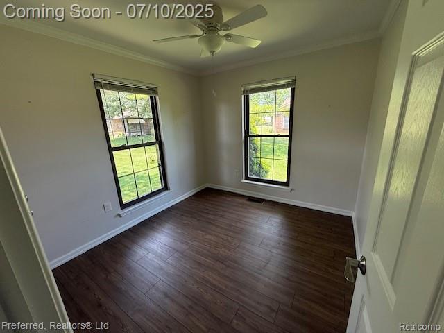 40219 Newport Dr, Plymouth, MI 48170 - unfurnished room with plenty of natural light, crown molding, ceiling fan, and dark wood-type flooring