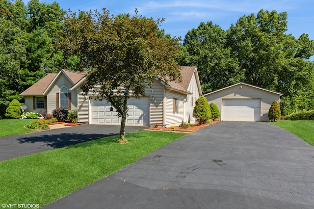4175 Schmuhl Rd, Coloma, MI 49038 - view of front of house with driveway, a front lawn, and an outdoor structure