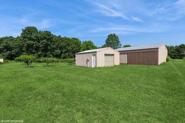4175 Schmuhl Rd, Coloma, MI 49038 - view of green lawn featuring an outdoor structure and a pole building