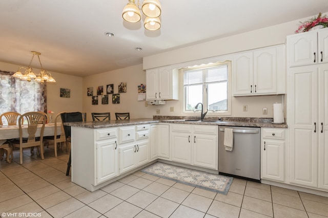 4175 Schmuhl Rd, Coloma, MI 49038 - kitchen featuring dishwasher, a chandelier, a peninsula, white cabinetry, and light tile patterned floors