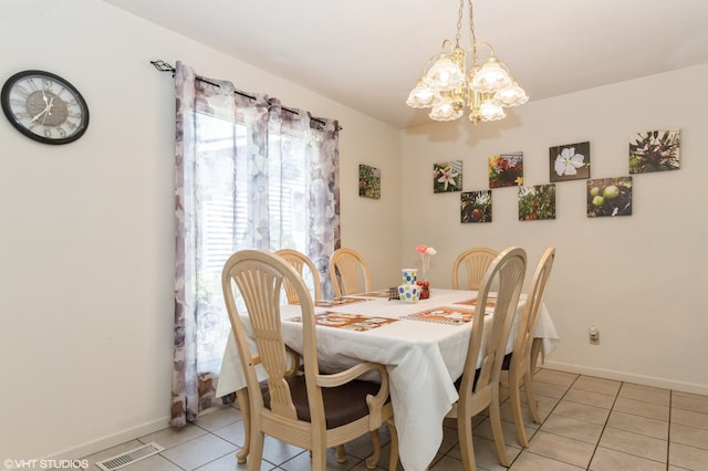 4175 Schmuhl Rd, Coloma, MI 49038 - dining area featuring light tile patterned flooring and a chandelier