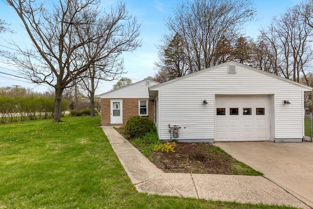 3116 E Apple Ave, Muskegon, MI 49442 - view of side of property featuring driveway and a lawn
