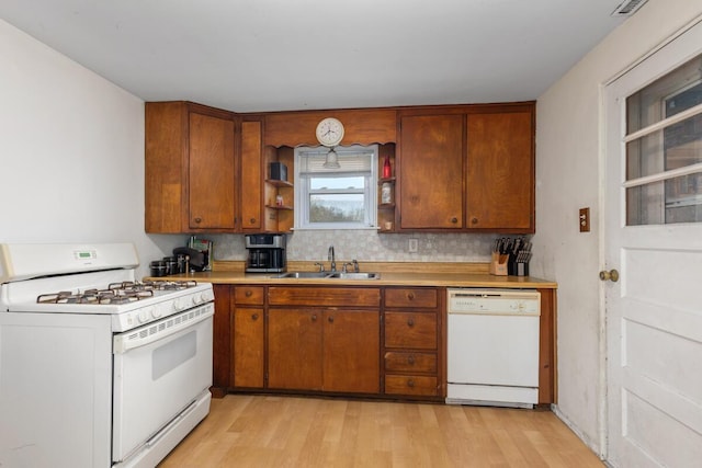 3116 E Apple Ave, Muskegon, MI 49442 - kitchen featuring white appliances, light wood finished floors, open shelves, and light countertops