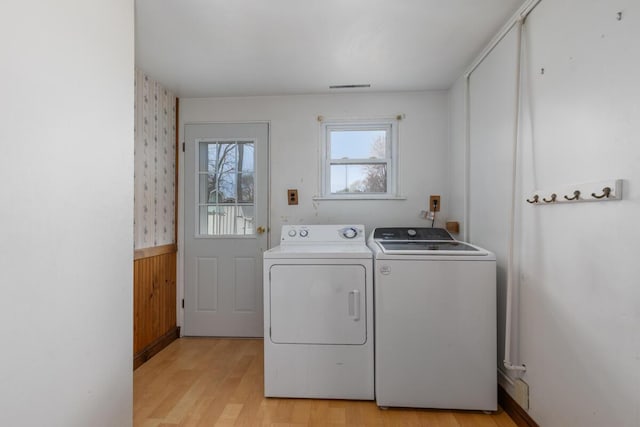 3116 E Apple Ave, Muskegon, MI 49442 - laundry area with separate washer and dryer, light wood-type flooring, and wainscoting