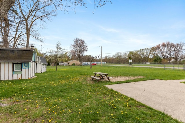 3116 E Apple Ave, Muskegon, MI 49442 - view of green lawn featuring an outbuilding