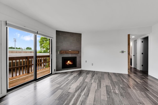 221 Pinewood Cir, Plymouth, MI 48170 - unfurnished living room with wood finished floors and a large fireplace
