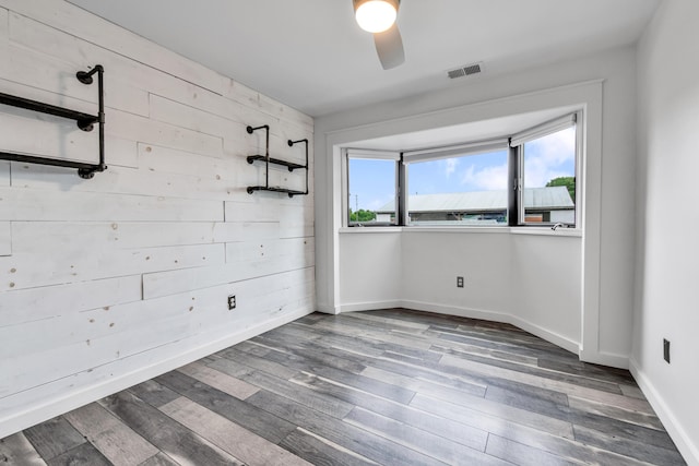 221 Pinewood Cir, Plymouth, MI 48170 - spare room with ceiling fan and wood finished floors