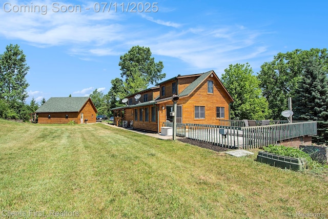 16501 Winters Rd, Grass Lake, MI 49240 - back of property featuring a yard and faux log siding