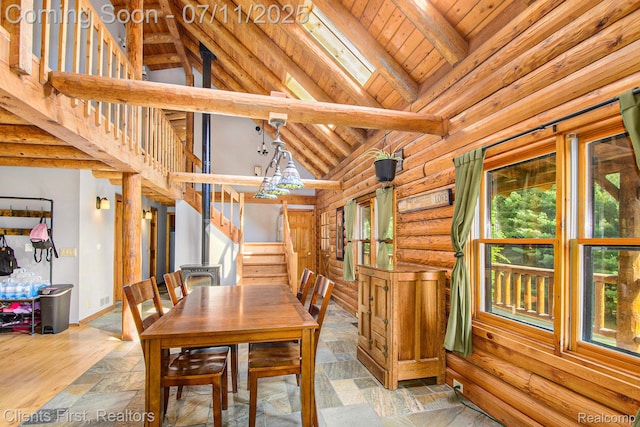 16501 Winters Rd, Grass Lake, MI 49240 - unfurnished dining area featuring rustic walls, high vaulted ceiling, a wooden ceiling with exposed beams, stairway, and stone finish floors