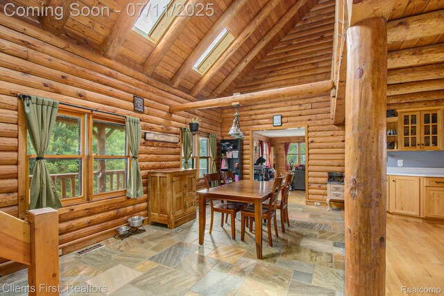 16501 Winters Rd, Grass Lake, MI 49240 - dining space with a skylight, high vaulted ceiling, rustic walls, and a wood ceiling with exposed beams