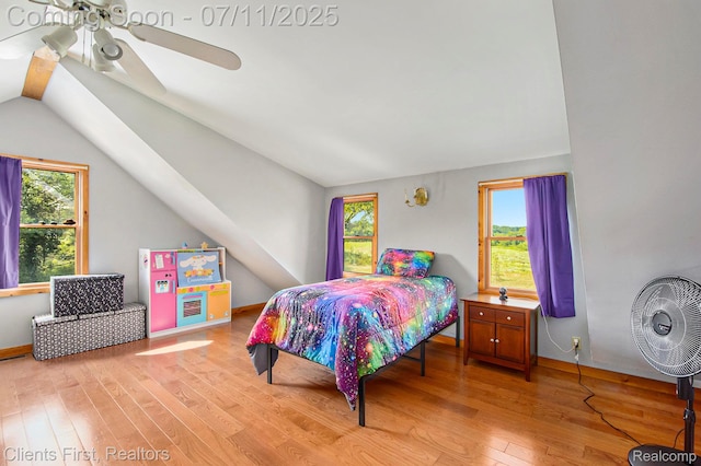 16501 Winters Rd, Grass Lake, MI 49240 - bedroom featuring light wood-type flooring, multiple windows, and vaulted ceiling