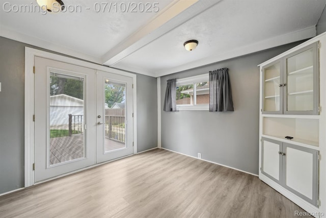 4309 Marr Ave, Warren, MI 48091 - spare room featuring french doors, light wood-style floors, and beam ceiling