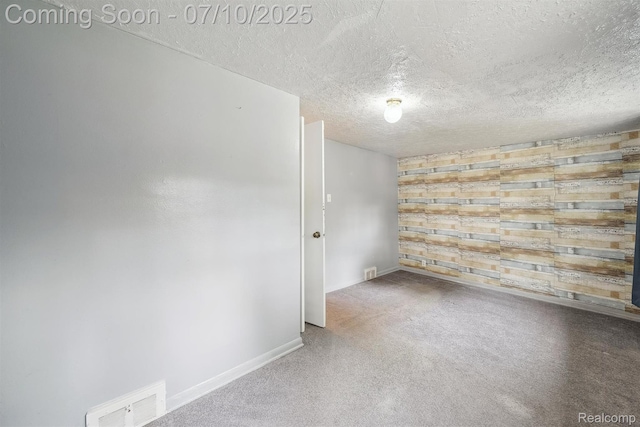 4309 Marr Ave, Warren, MI 48091 - carpeted spare room with a textured ceiling and baseboards