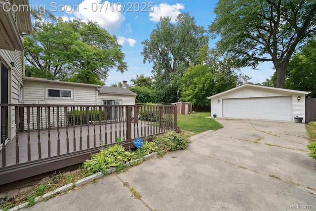 4309 Marr Ave, Warren, MI 48091 - view of yard with a wooden deck, a garage, and a shed