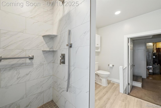 4309 Marr Ave, Warren, MI 48091 - bathroom featuring a marble finish shower and wood finished floors