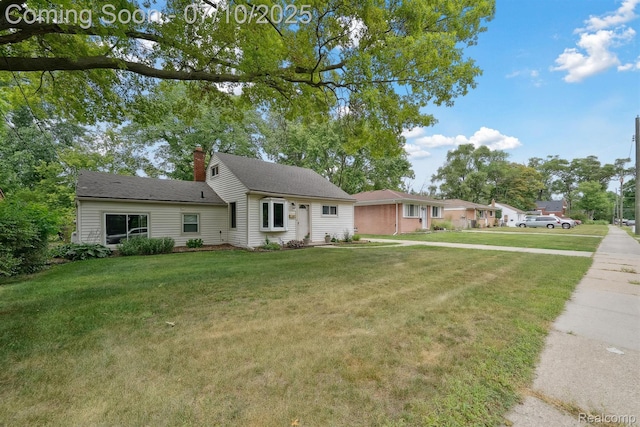 4309 Marr Ave, Warren, MI 48091 - view of front of house featuring a front yard and a chimney