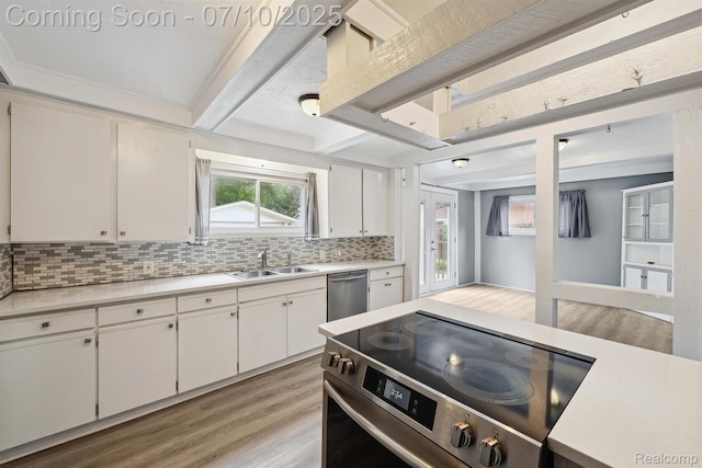 4309 Marr Ave, Warren, MI 48091 - kitchen with stainless steel appliances, light wood-style floors, light countertops, and beamed ceiling