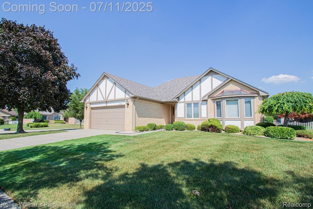48600 Meadowcrest Dr, Macomb, MI 48044 - tudor house featuring a garage, concrete driveway, a front lawn, and brick siding