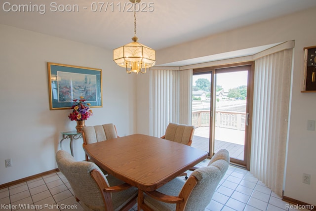 48600 Meadowcrest Dr, Macomb, MI 48044 - dining room featuring light tile patterned floors and a chandelier