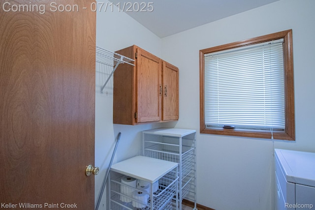 48600 Meadowcrest Dr, Macomb, MI 48044 - laundry room with cabinet space and washer and clothes dryer