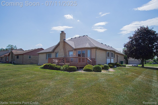 48600 Meadowcrest Dr, Macomb, MI 48044 - back of house featuring brick siding, a chimney, a deck, a lawn, and a garage