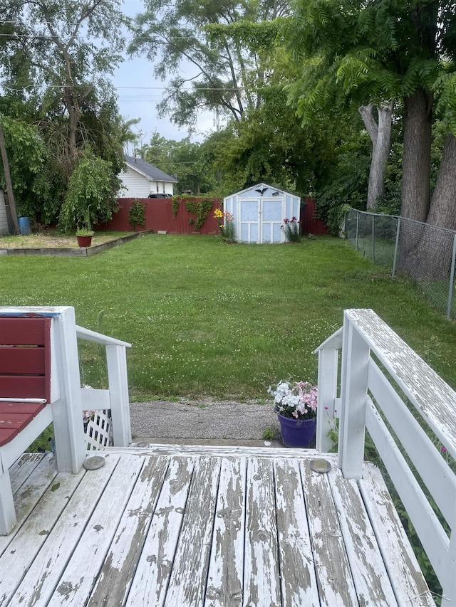 2205 Owen St, Saginaw, MI 48601 - wooden terrace featuring a shed and a fenced backyard