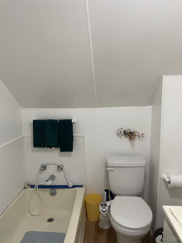 2205 Owen St, Saginaw, MI 48601 - bathroom featuring a garden tub, wood finished floors, and vanity