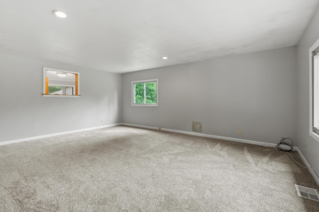 1402 Gracel St, Jackson, MI 49202 - empty room featuring carpet and recessed lighting