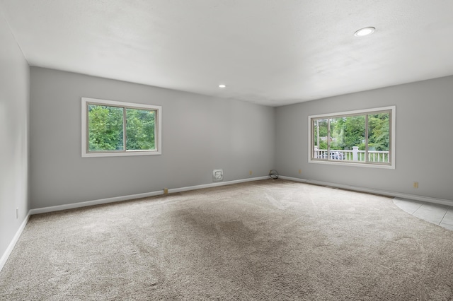 1402 Gracel St, Jackson, MI 49202 - carpeted spare room with plenty of natural light and recessed lighting
